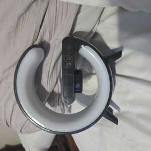 Black and White speaker and wireless phone charger